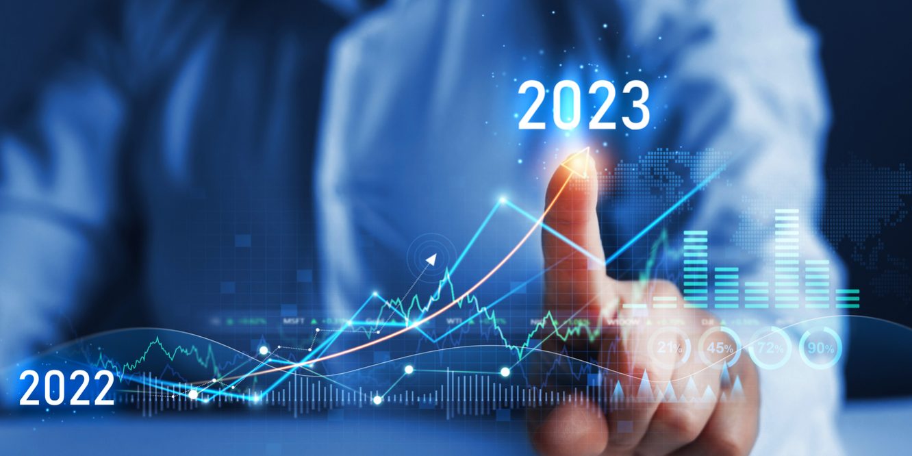 Business person draws increase arrow graph corporate future growth year 2022 to 2023. New Goals, Plans and Visions for Next Year 2023.
